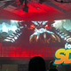 A red-tinged dragon on a giant screen.